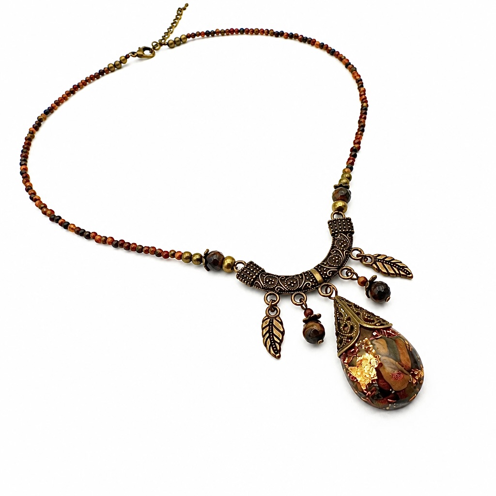 Collier orgonite goutte oeil de tigre décor Tibet